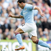 Manchester City's Carlos Tevez is seen on his way to scoring aga