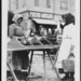 Woman selling food in market, Hungary 1920