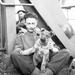A British soldier and his dog on a ship bound for England after 