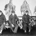 Three United States soldiers and their war dogs, who have been p