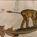 A monkey with an arrow stuck in its butt