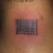 ripped-skin-barcode-tattoo-on-nape