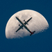 airplane-passing-the-mooon-perfect-timing